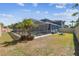 Wide angle shot of the backyard with screened-in pool and room for outdoor activities at 11852 Lake Lucaya Dr, Riverview, FL 33579