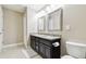 Bathroom with a double sink vanity featuring granite countertops and tile floors at 11852 Lake Lucaya Dr, Riverview, FL 33579