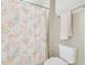 Cozy bathroom featuring a floral shower curtain and a towel rack at 11852 Lake Lucaya Dr, Riverview, FL 33579