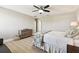 Bedroom with a ceiling fan, a dresser, and plenty of room for rest and relaxation at 11852 Lake Lucaya Dr, Riverview, FL 33579
