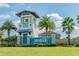 Community entrance to Lucaya Lake Club featuring a beautiful welcome sign, landscaping, and coastal architectural features at 11852 Lake Lucaya Dr, Riverview, FL 33579
