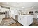 Bright open kitchen with a large island, seating, stainless steel appliances, and a seamless flow to living spaces at 11852 Lake Lucaya Dr, Riverview, FL 33579