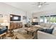 Spacious living room with comfortable seating and a large entertainment center at 11852 Lake Lucaya Dr, Riverview, FL 33579