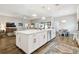 Open-concept living space featuring a kitchen with a large island and a bright living room, seamlessly connected at 11852 Lake Lucaya Dr, Riverview, FL 33579