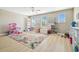 Spacious loft featuring lots of natural light and open space for children to play at 11852 Lake Lucaya Dr, Riverview, FL 33579