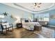 Spacious main bedroom with trey ceiling, ceiling fan and stylish furniture at 11852 Lake Lucaya Dr, Riverview, FL 33579
