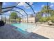 Enjoy the Florida sunshine with the screened-in pool and seating area, with an attached spa at 11852 Lake Lucaya Dr, Riverview, FL 33579