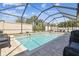 Cool off in the screened-in pool, with a spacious patio for dining or lounging at 11852 Lake Lucaya Dr, Riverview, FL 33579