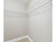 Spacious walk-in closet with white wire shelving for optimal storage and organization at 11852 Lake Lucaya Dr, Riverview, FL 33579