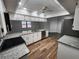 Bright kitchen featuring white cabinets, granite countertops, and stainless steel appliances at 12312 Golden Oak Cir, Hudson, FL 34669