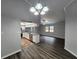 Open kitchen layout boasts white cabinets, stainless appliances, and granite counters at 12312 Golden Oak Cir, Hudson, FL 34669