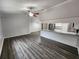 Open-concept living area with modern flooring, neutral paint, and access to kitchen at 12312 Golden Oak Cir, Hudson, FL 34669