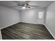 Bright living room featuring vinyl floors, neutral walls and a glass panel door at 12312 Golden Oak Cir, Hudson, FL 34669