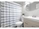 Clean bathroom with a shower, modern vanity, and neutral color scheme at 1276 Bertland Way, Clearwater, FL 33755