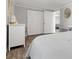 Bright bedroom with a comfortable bed, sleek laminate flooring, and ample closet space, offering a relaxing retreat at 1276 Bertland Way, Clearwater, FL 33755