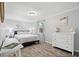 Cozy bedroom with white furniture and decor, offering a tranquil space at 1276 Bertland Way, Clearwater, FL 33755