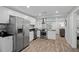 Modern kitchen with stainless steel appliances, sleek countertops, and ample cabinet space, perfect for cooking and entertaining at 1276 Bertland Way, Clearwater, FL 33755