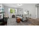 Inviting living room with a cozy sofa, stylish rug, and ample natural light, creating a comfortable and welcoming space at 1276 Bertland Way, Clearwater, FL 33755