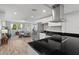 Open concept living room boasts lots of natural light and flows into the kitchen, perfect for entertaining at 1276 Bertland Way, Clearwater, FL 33755