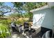 Inviting outdoor patio with stylish seating, perfect for relaxing and enjoying the serene backyard at 1276 Bertland Way, Clearwater, FL 33755