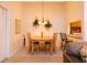 Cozy dining room with neutral color scheme, featuring an inviting table, chairs and decor at 1309 Pine Ridge E Cir # D3, Tarpon Springs, FL 34688