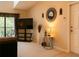 Bright living room with neutral walls, a large TV, and decor, showcasing comfortable interior living at 1309 Pine Ridge E Cir # D3, Tarpon Springs, FL 34688