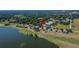 Aerial view of a home situated on a golf course near a lake at 13421 Sydney Rd, Valrico, FL 33594