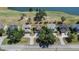 Aerial view of homes nestled near a serene lake and golf course, showcasing the community at 13421 Sydney Rd, Valrico, FL 33594