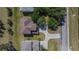 Overhead view of home with long driveway and mature trees surrounding the property at 13421 Sydney Rd, Valrico, FL 33594