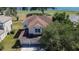 Aerial view of a two story home, surrounded by lush greenery at 13421 Sydney Rd, Valrico, FL 33594