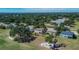 An aerial view of a home featuring a lush backyard and surrounding landscape at 13421 Sydney Rd, Valrico, FL 33594