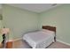 This bedroom features soothing green walls, plush carpet, and a cozy bed, creating a relaxing atmosphere at 13421 Sydney Rd, Valrico, FL 33594