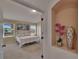Cozy bedroom with natural light and windows with scenic views, creating a serene atmosphere at 13421 Sydney Rd, Valrico, FL 33594