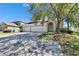 Inviting two-story home with a well-manicured lawn, a long driveway, and a two car garage at 13421 Sydney Rd, Valrico, FL 33594