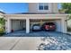 Two car garage featuring two vehicles and ample storage space, providing convenience and organization at 13421 Sydney Rd, Valrico, FL 33594