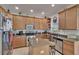 Well-equipped kitchen boasts ample cabinet space, stainless steel appliances, and a functional island at 13421 Sydney Rd, Valrico, FL 33594