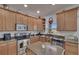 Beautiful kitchen featuring light wood cabinetry, stainless appliances and a center island with seating at 13421 Sydney Rd, Valrico, FL 33594