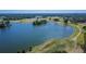Scenic aerial view of a large lake surrounded by lush green golf course at 13421 Sydney Rd, Valrico, FL 33594