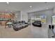 Open floor plan featuring the living room, dining area, and kitchen, seamlessly connected with ample natural light at 13421 Sydney Rd, Valrico, FL 33594
