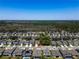 An aerial view of a new home community with lush green landscaping and beautiful home exteriors at 14146 Samoa Hill Ct, Riverview, FL 33569