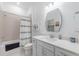 Well-lit bathroom featuring a shower-tub combo and modern vanity at 14146 Samoa Hill Ct, Riverview, FL 33569