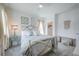 Charming bedroom featuring a metal bed, soft lighting, and neutral accents at 14146 Samoa Hill Ct, Riverview, FL 33569