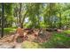 Outdoor fire pit area surrounded by wooden chairs, ideal for gatherings and relaxation at 14146 Samoa Hill Ct, Riverview, FL 33569