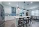 Modern kitchen featuring white cabinets, stainless steel appliances, and a stylish backsplash at 14146 Samoa Hill Ct, Riverview, FL 33569