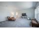 Spacious living room with neutral carpet, stylish furniture, and a bright window at 14146 Samoa Hill Ct, Riverview, FL 33569