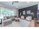 Comfortable living area featuring a large window and stylish decor at 14146 Samoa Hill Ct, Riverview, FL 33569