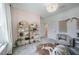 Cozy office space featuring a decorative bookshelf, neutral walls, and a statement rug at 14146 Samoa Hill Ct, Riverview, FL 33569