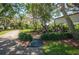 Community playground with wooden features and green space for recreation and Gathering activities at 14146 Samoa Hill Ct, Riverview, FL 33569