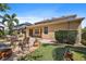 An appealing backyard features a patio, fire pit, potted plants, and lush landscaping at 15608 Starling Water Dr, Lithia, FL 33547
