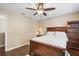 This bedroom features hardwood floors, a ceiling fan, and neutral paint, creating a relaxing atmosphere at 15608 Starling Water Dr, Lithia, FL 33547